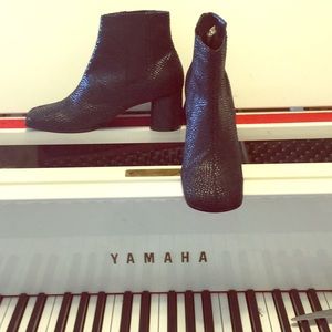 Black textured ankle boots with medium heels